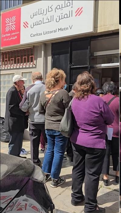 Description: A group of people standing outside a building  AI-generated content may be incorrect.